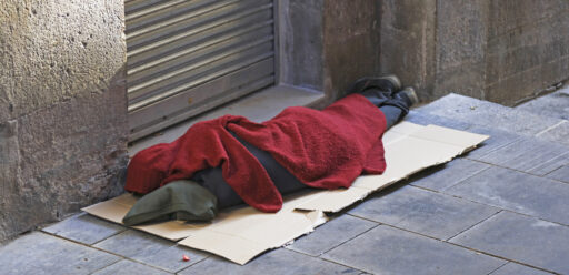 Homeless person sleeping on street